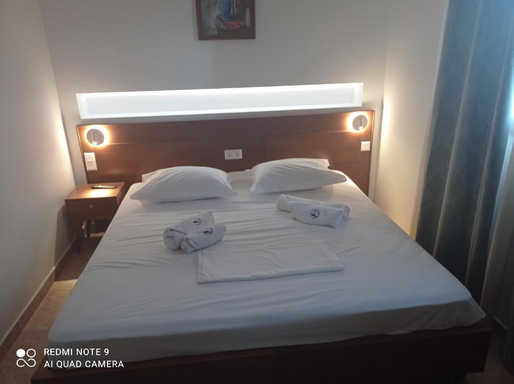Classic Double Room with a warm wood headboard